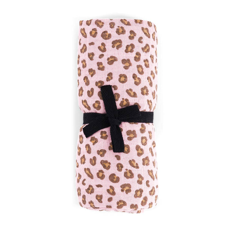 Folded fabric with leopard print and black ribbon on a white background