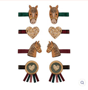 Set of horse-shaped hair clips with decorative elements on a white background